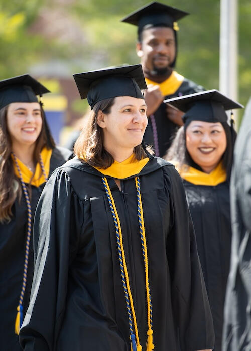Melanie and grads at Commencement Melanie and grads at Commencement. Photo by UMPI / Dave Allen / Becky Shea